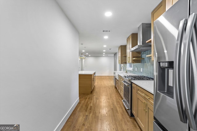 800 Kiowa Dr NE, Marietta, GA 30060 - kitchen with stainless steel appliances, wall chimney range hood, baseboards, brown cabinets, and backsplash