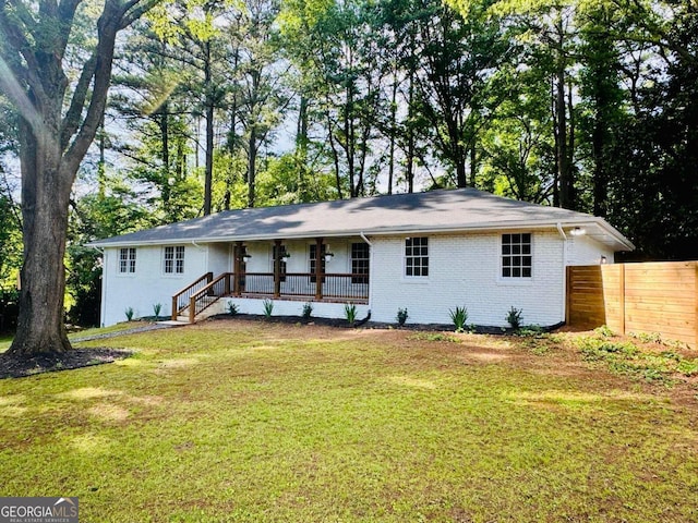 800 Kiowa Dr NE, Marietta, GA 30060 - back of house featuring a porch and brick siding