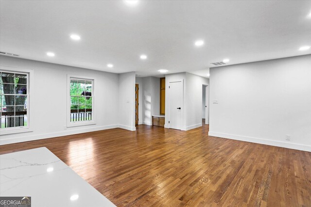 800 Kiowa Dr NE, Marietta, GA 30060 - unfurnished living room with wood finished floors, recessed lighting, and baseboards
