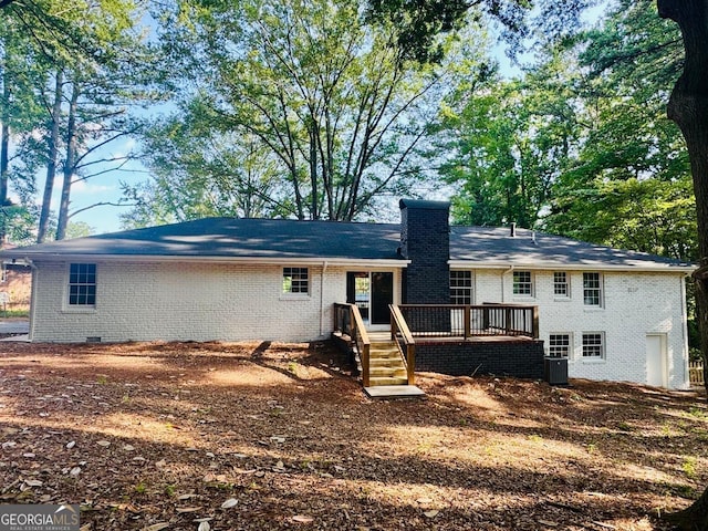 800 Kiowa Dr NE, Marietta, GA 30060 - rear view of property featuring brick siding, a chimney, and a deck