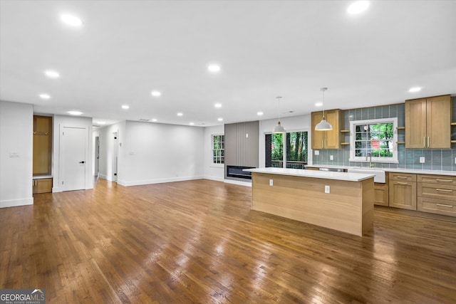 800 Kiowa Dr NE, Marietta, GA 30060 - kitchen featuring a kitchen island, light countertops, recessed lighting, dark wood-style floors, and backsplash