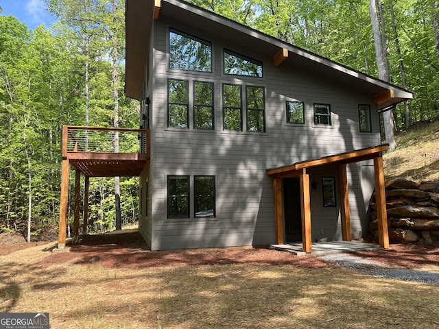 162 Forest Canopy Way, Clayton, GA 30525 - rear view of house with a wooden deck
