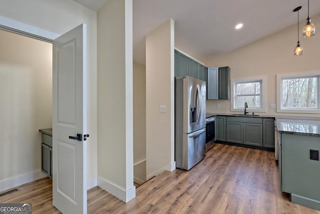 162 Forest Canopy Way, Clayton, GA 30525 - kitchen with decorative light fixtures, visible vents, appliances with stainless steel finishes, light wood-type flooring, and a sink