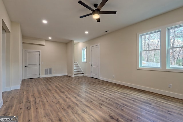 162 Forest Canopy Way, Clayton, GA 30525 - empty room featuring stairs, recessed lighting, a ceiling fan, wood finished floors, and visible vents