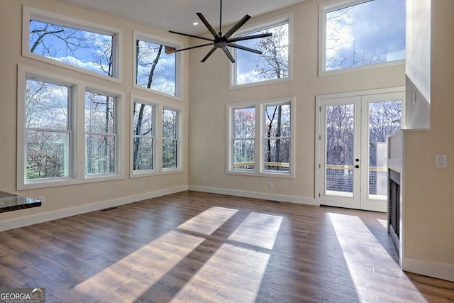 162 Forest Canopy Way, Clayton, GA 30525 - interior space featuring baseboards, a healthy amount of sunlight, and wood finished floors