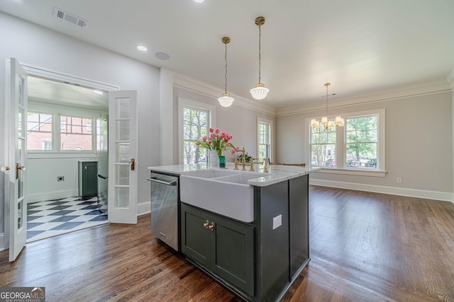 kitchen with a sink, appliances with stainless steel finishes, baseboards, a notable chandelier, and visible vents