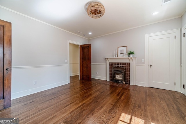 unfurnished living room featuring crown molding, wood finished floors, a tile fireplace, baseboards, and recessed lighting