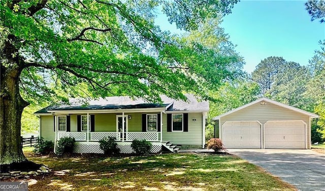 1836 Rainbow Ln, Powder Springs, GA 30127 - view of front of property featuring covered porch, a garage, and an outbuilding