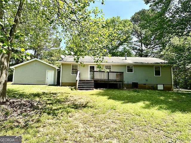 1836 Rainbow Ln, Powder Springs, GA 30127 - back of house featuring a lawn, a deck, an outdoor structure, and central AC