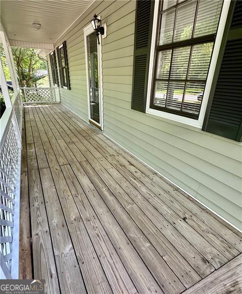 1836 Rainbow Ln, Powder Springs, GA 30127 - deck featuring covered porch