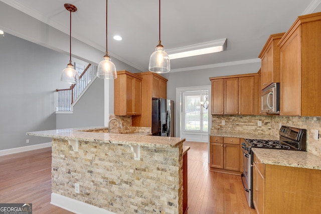 kitchen with tasteful backsplash, stainless steel appliances, light wood finished floors, a peninsula, and light stone countertops