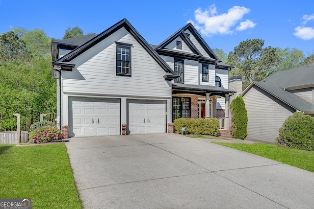 view of front facade featuring a front lawn, driveway, a porch, a garage, and brick siding