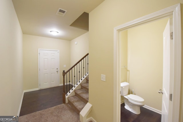 interior space featuring baseboards and visible vents