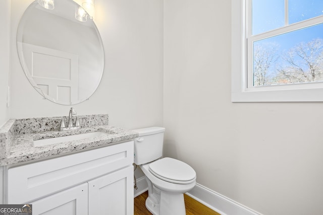 405 Roper Dr, Clarkesville, GA 30523 - bathroom featuring wood finished floors, vanity, toilet, and baseboards