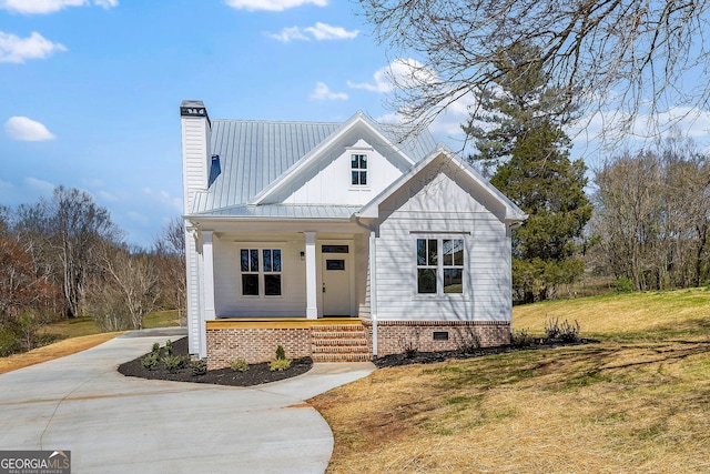 405 Roper Dr, Clarkesville, GA 30523 - view of front of house with a front lawn, driveway, a chimney, covered porch, and crawl space