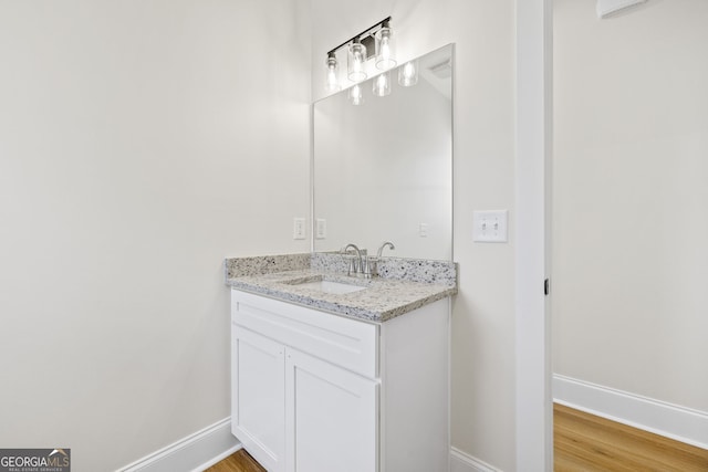 405 Roper Dr, Clarkesville, GA 30523 - bathroom featuring wood finished floors, vanity, and baseboards