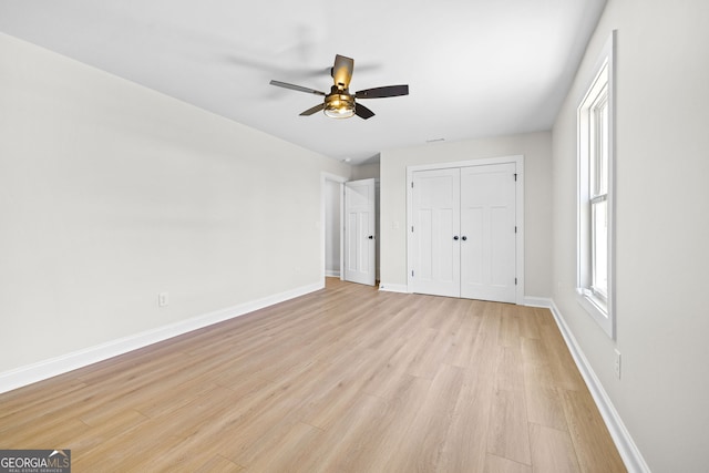 405 Roper Dr, Clarkesville, GA 30523 - unfurnished bedroom with light wood-style floors, baseboards, and ceiling fan