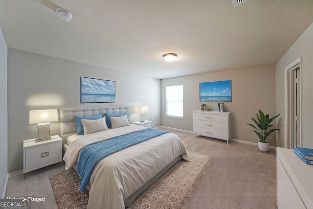 bedroom with baseboards and light colored carpet