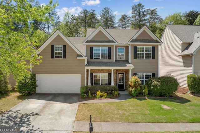 view of front of house with driveway, a garage, a shingled roof, and a front yard