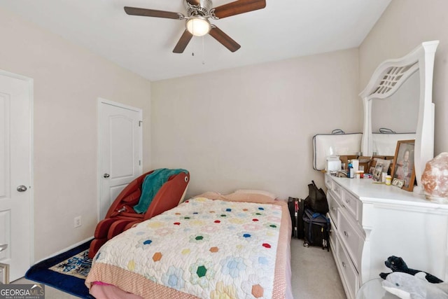 bedroom featuring light colored carpet and ceiling fan