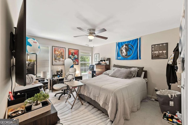 bedroom featuring carpet floors, a ceiling fan, and baseboards