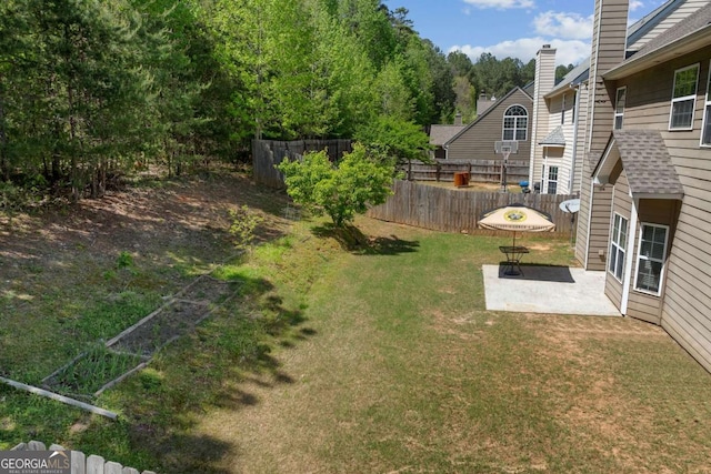 view of yard featuring a patio and fence