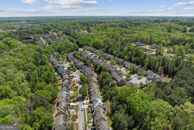 aerial view with a residential view and a wooded view