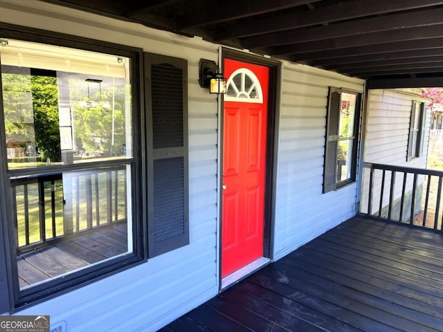 doorway to property with a porch