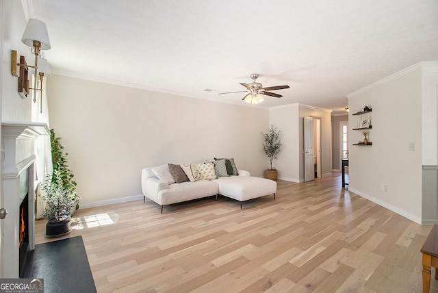 5 Stony Oak Dr, Newnan, GA 30263 - living room with a fireplace with flush hearth, ceiling fan, light wood-style floors, baseboards, and ornamental molding
