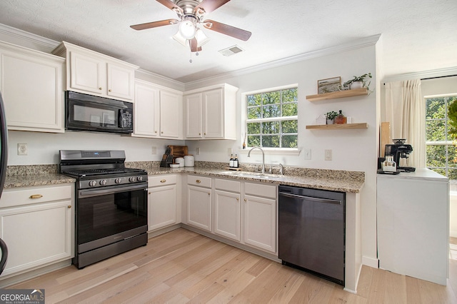 5 Stony Oak Dr, Newnan, GA 30263 - kitchen featuring dishwasher, stainless steel range with gas cooktop, black microwave, a sink, and light wood-type flooring