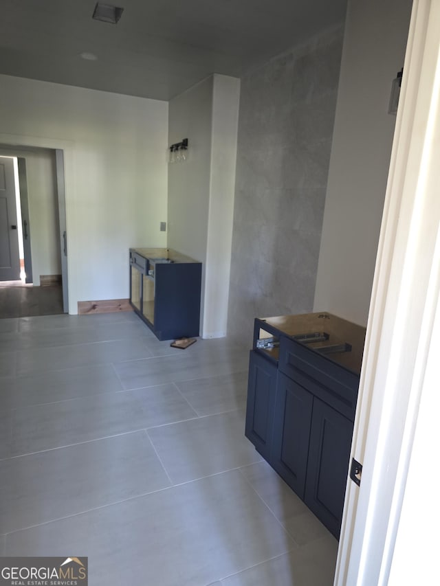 kitchen with light tile patterned flooring