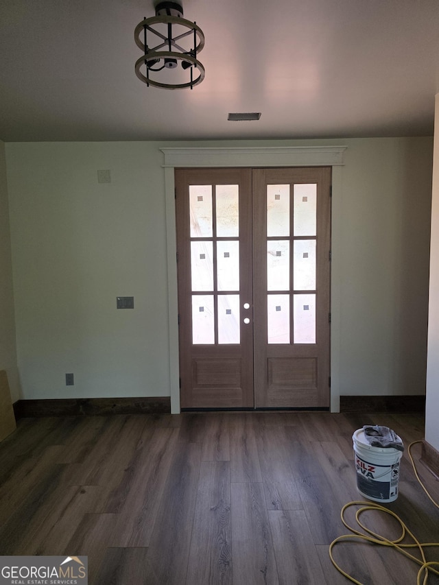 211 Lake Chase Dr N, Griffin, GA 30224 - entryway with french doors, dark wood finished floors, and baseboards