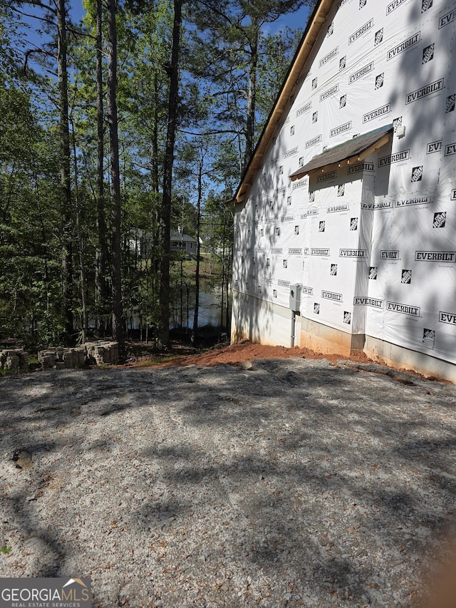 view of side of home with crawl space