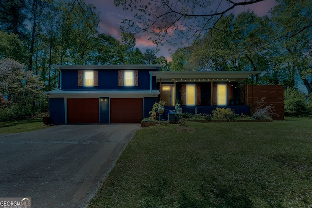 2673 Rainbow Forest Dr, Decatur, GA 30034 - split level home with an attached garage, a front lawn, and concrete driveway