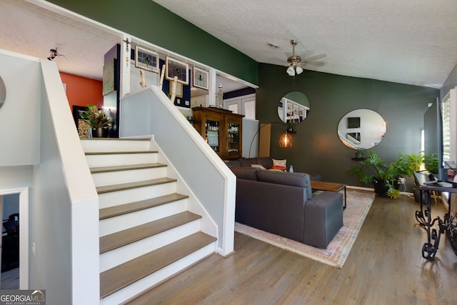2673 Rainbow Forest Dr, Decatur, GA 30034 - living room with stairs, a ceiling fan, wood finished floors, and a textured ceiling