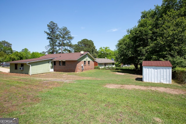 view of yard with an outdoor structure and a shed
