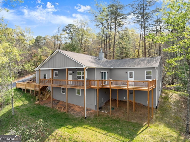 527 Abby, Clayton, GA 30525 - back of house with a deck, a chimney, a lawn, and roof with shingles