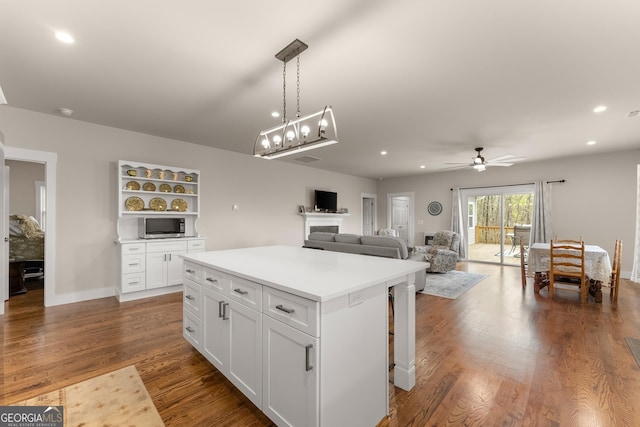 527 Abby, Clayton, GA 30525 - kitchen with white cabinetry, a center island, recessed lighting, ceiling fan, and hanging light fixtures
