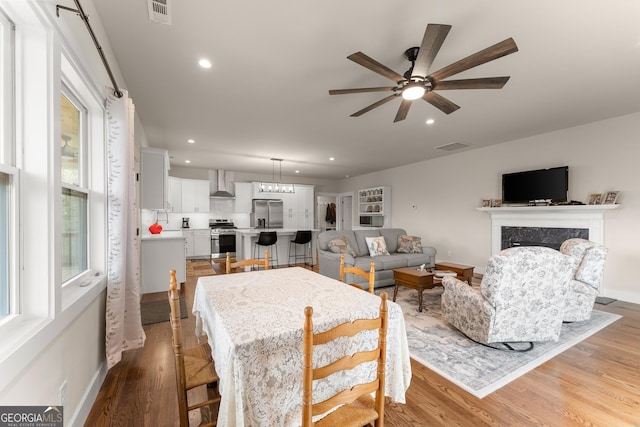 527 Abby, Clayton, GA 30525 - dining room with ceiling fan, recessed lighting, light wood-style flooring, and a high end fireplace