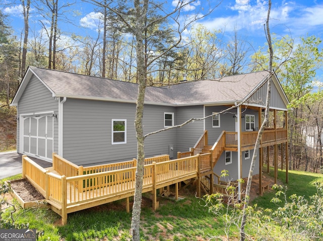 527 Abby, Clayton, GA 30525 - rear view of property featuring a wooden deck, roof with shingles, a garage, and stairway