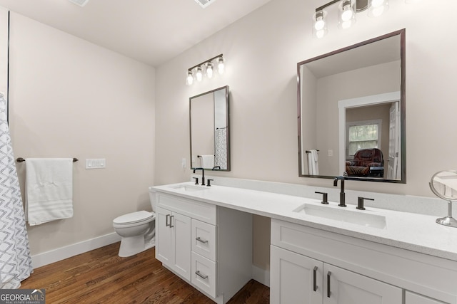 527 Abby, Clayton, GA 30525 - bathroom featuring double vanity, wood finished floors, and connected bathroom