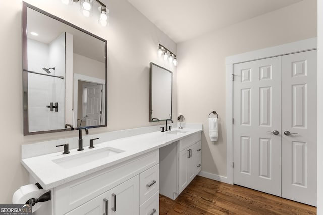 527 Abby, Clayton, GA 30525 - bathroom featuring double vanity, wood finished floors, and a shower