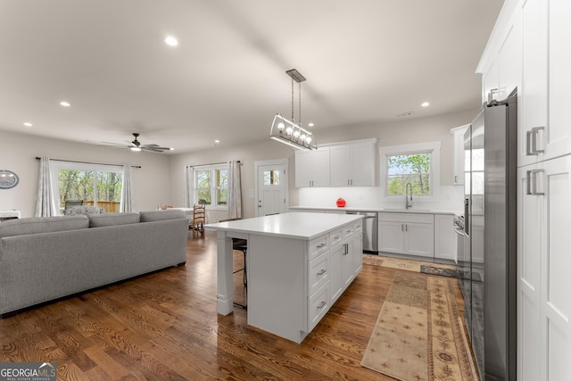 527 Abby, Clayton, GA 30525 - kitchen with open floor plan, recessed lighting, appliances with stainless steel finishes, healthy amount of natural light, and white cabinets