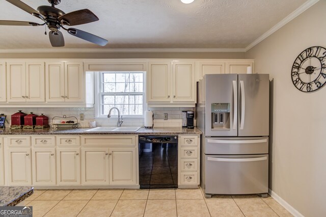 kitchen featuring a sink, cream cabinets, backsplash, a peninsula, and appliances with stainless steel finishes