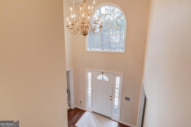 corridor featuring dark wood-style floors, visible vents, ornamental molding, baseboards, and a textured ceiling