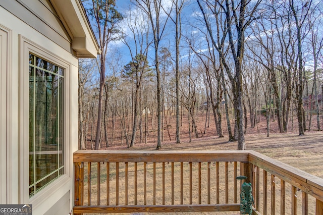 view of yard featuring a wooden deck and central AC unit