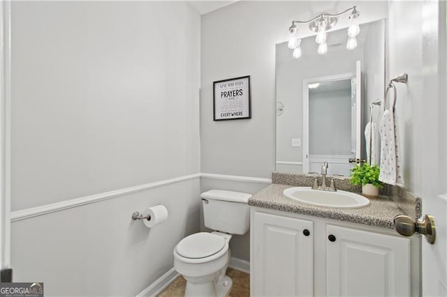 half bath with vanity and toilet