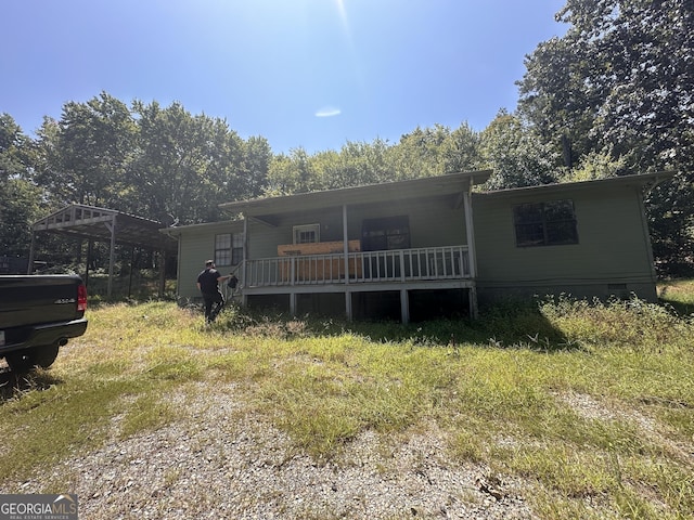 91 Lee Edwards Dr, Lafayette, GA 30728 - view of front facade featuring a porch and a detached carport