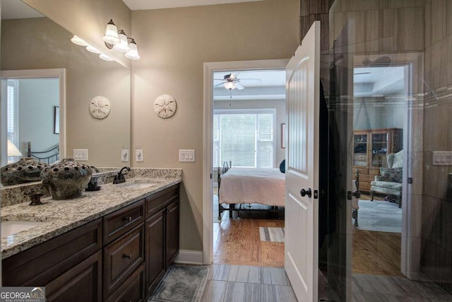 17 Ivy Stone Ct SE, Cartersville, GA 30120 - bathroom featuring a sink, double vanity, ensuite bathroom, baseboards, and ceiling fan