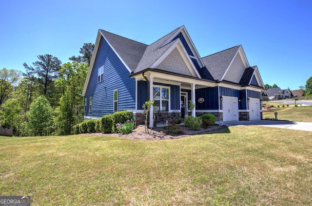 17 Ivy Stone Ct SE, Cartersville, GA 30120 - view of front facade with concrete driveway, an attached garage, board and batten siding, and a front lawn